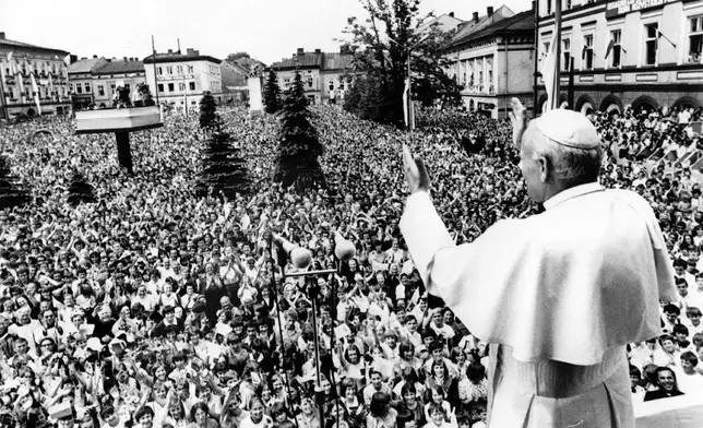 FILE - Pope John Paul II. waves to huge crowd of faithful downtown Wadowice, the hometown of the Pope he is visiting on June 7, 1979, for the first time he had been elected as Pope. It is the Pontiff's sixth day of his nine-day-visit to his homeland Poland. (AP Photo/POOL, File)