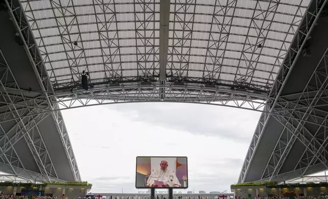 Pope Francis presides over a mass 'In Memory of the Most Holy Name of Mary' celebrated by the Archbishop of Singapore, Cardinal William Goh Seng Chye at the Singapore SportsHub National Stadium, Thursday, Sept. 12, 2024. In Singapore, his final stop of an 11-day trip to Asia and Oceania, Francis once again ditched his remarks when he arrived at the last event, a meeting of Singaporean youth on Friday morning."That's the talk I prepared," he said, pointing to his speech and then proceeding to launch into a spontaneous back-and-forth with the young people about the need to have courage and take risks. (AP Photo/Gregorio Borgia)