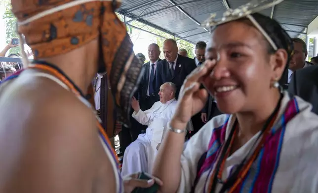 Pope Francis arrives at Dili's Presidente Nicolau Lobato International Airport, East Timor, Monday, Sept. 9, 2024. In East Timor Francis had to negotiate perhaps the most sensitive issue clouding the visit to Asia and Oceania : the case of Bishop Carlos Ximenes Belo, the revered national hero who won the Nobel Peace Prize for his nonviolent independence campaign. (AP Photo/Gregorio Borgia)