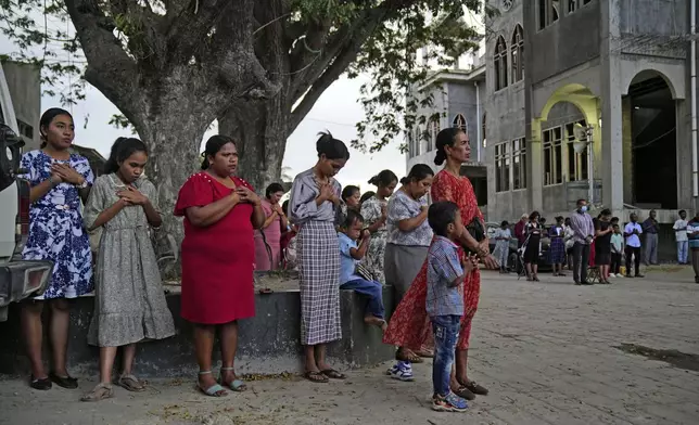 People pray during a Sunday mass ahead of Pope Francis' visit to East Timor, at a church in Dili, Sunday, Sept. 8, 2024. (AP Photo/Dita Alangkara)