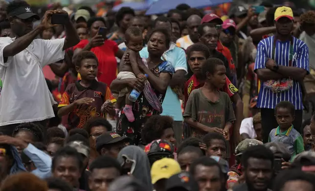 Faithful wait for Pope Francis to arrive at a meeting with faithful in Vanimo, Papua New Guinea, Sunday, Sept. 8, 2024. (AP Photo/Gregorio Borgia)