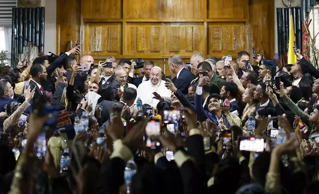 Pope Francis greets people at the Presidential Palace in Dili, East Timor, Monday, Sept. 9, 2024. (Willy Kurniawan/Pool Photo via AP)