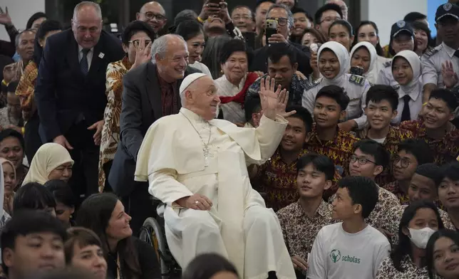 Pope Francis interacts with the young people of Scholas Occurrentes at Grha Pemuda Youth Center in Jakarta, Indonesia, Wednesday, Sept. 4, 2024. (AP Photo/Tatan Syuflana, Pool)