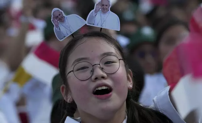 A girl reacts as Pope Francis arrives at Madya Stadium in Jakarta, Indonesia, Thursday, Sept. 5, 2024. (AP Photo/Tatan Syuflana)