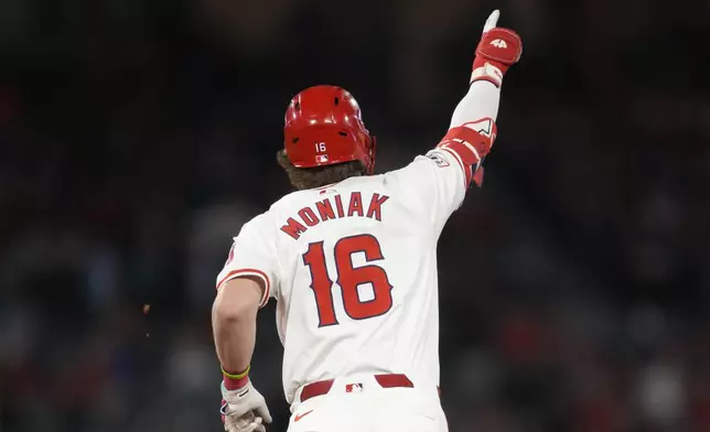 Los Angeles Angels' Mickey Moniak celebrates as he runs the bases after hitting a home run during the fourth inning of a baseball game against the Houston Astros in Anaheim, Calif., Friday, Sept. 13, 2024. (AP Photo/Ashley Landis)