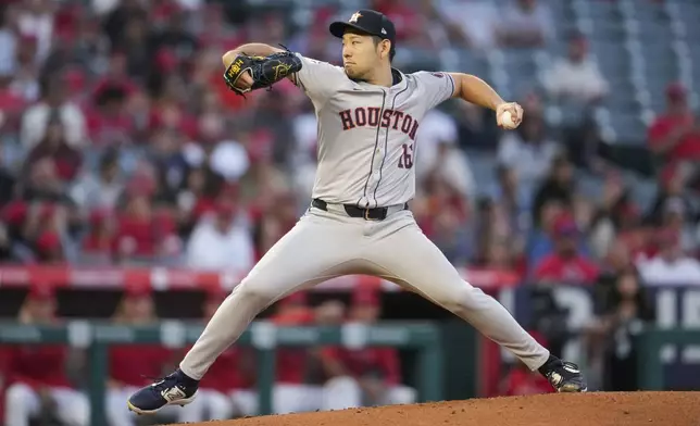 Houston Astros starting pitcher Yusei Kikuchi throws during the first inning of a baseball game against the Los Angeles Angels in Anaheim, Calif., Friday, Sept. 13, 2024. (AP Photo/Ashley Landis)