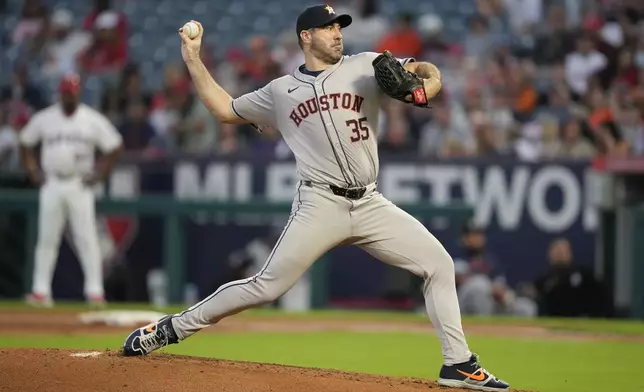 Houston Astros starting pitcher Justin Verlander throws during the first inning of a baseball game against the Los Angeles Angels in Anaheim, Calif., Saturday, Sept. 14, 2024. (AP Photo/Ashley Landis)