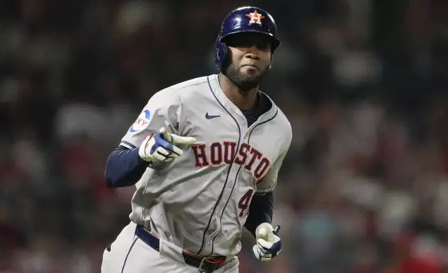 Houston Astros designated hitter Yordan Alvarez runs the bases after hitting a home run during the fifth inning of a baseball game against the Los Angeles Angels in Anaheim, Calif., Saturday, Sept. 14, 2024. Jose Altuve also scored. (AP Photo/Ashley Landis)