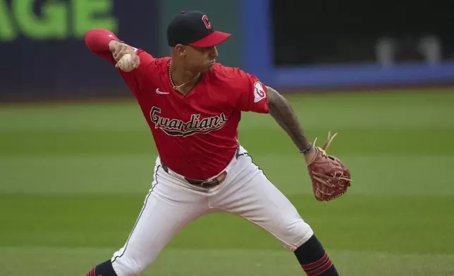 Cleveland Guardians' Brayan Rocchio throws Houston Astros' Jeremy Pena out at first base during the first inning of a baseball game in Cleveland, Saturday, Sept. 28, 2024. (AP Photo/Phil Long)