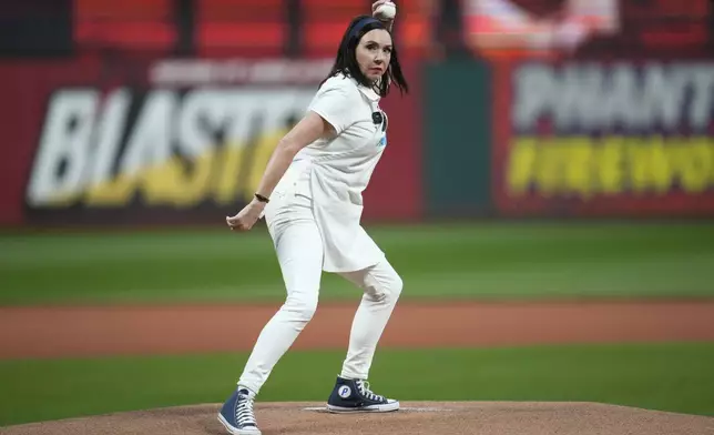 Progressive Insurance spokesperson Flo throws out a ceremonial first pitch before a baseball game between the Houston Astros and the Cleveland Guardians in Cleveland, Friday, Sept. 27, 2024. (AP Photo/Sue Ogrocki)