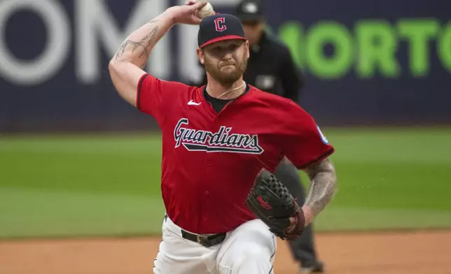 Cleveland Guardians starting pitcher Ben Lively delivers against the Houston Astros during the first inning of a baseball game in Cleveland, Saturday, Sept. 28, 2024. (AP Photo/Phil Long)