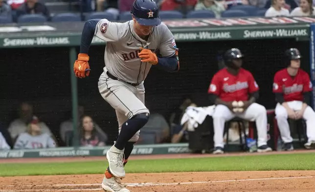 Houston Astros' Zach Dezenzo heads to first base and is safe on a two-run RBI error during the second inning of a baseball game against the Cleveland Guardians in Cleveland, Saturday, Sept. 28, 2024. (AP Photo/Phil Long)