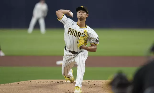 San Diego Padres starting pitcher Yu Darvish works against a Houston Astros batter during the first inning of a baseball game Monday, Sept. 16, 2024, in San Diego. (AP Photo/Gregory Bull)