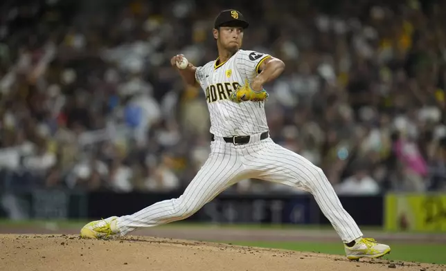 San Diego Padres starting pitcher Yu Darvish works against a Houston Astros batter during the first inning of a baseball game Monday, Sept. 16, 2024, in San Diego. (AP Photo/Gregory Bull)