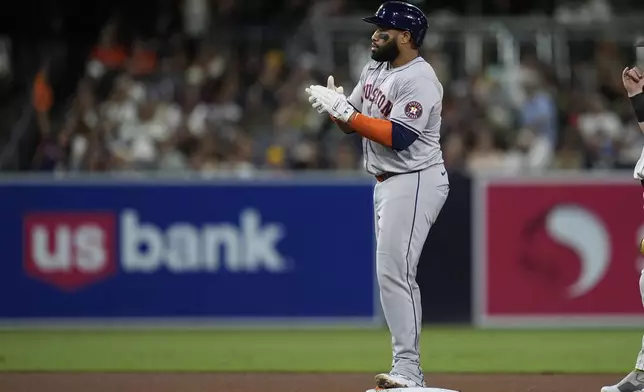 Houston Astros' Jon Singleton celebrates his RBI double during the fourth inning of a baseball game against the San Diego Padres, Tuesday, Sept. 17, 2024, in San Diego. (AP Photo/Gregory Bull)