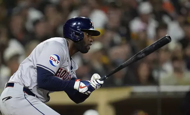 Houston Astros' Yordan Alvarez watches his RBI single during the eighth inning of a baseball game against the San Diego Padres Monday, Sept. 16, 2024, in San Diego. (AP Photo/Gregory Bull)