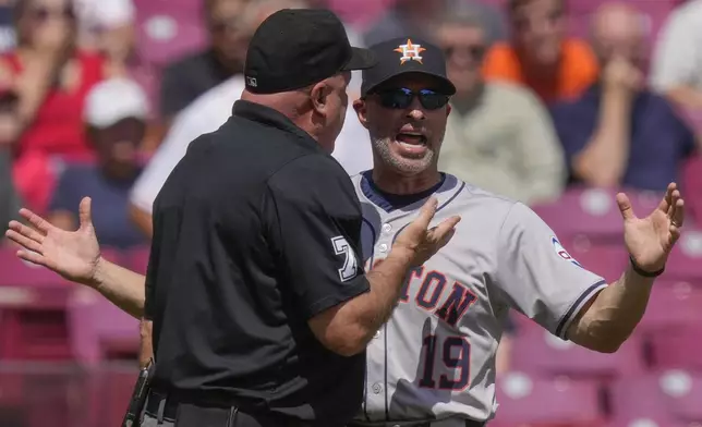 Houston Astros manager Joe Espada (19) reacts to being ejected by home plate umpire Brian O'Nora during the fourth inning of a baseball game against the Cincinnati Reds, Thursday, Sept. 5, 2024, in Cincinnati. (AP Photo/Carolyn Kaster)