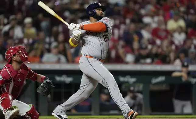 Houston Astros' Jon Singleton watches his home run during the seventh inning of a baseball game against the Cincinnati Reds, Wednesday, Sept. 4, 2024, in Cincinnati. (AP Photo/Carolyn Kaster)