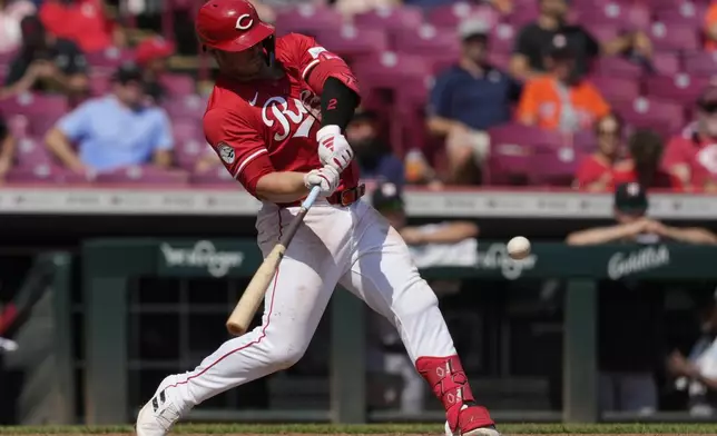 Cincinnati Reds' Ty France hits a home run during the seventh inning of a baseball game against the Houston Astros, Thursday, Sept. 5, 2024, in Cincinnati. (AP Photo/Carolyn Kaster)