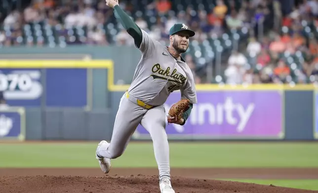 Oakland Athletics starting pitcher Mitch Spence throws against the Houston Astros during the first inning of a baseball game Thursday, Sept. 12, 2024, in Houston. (AP Photo/Michael Wyke)