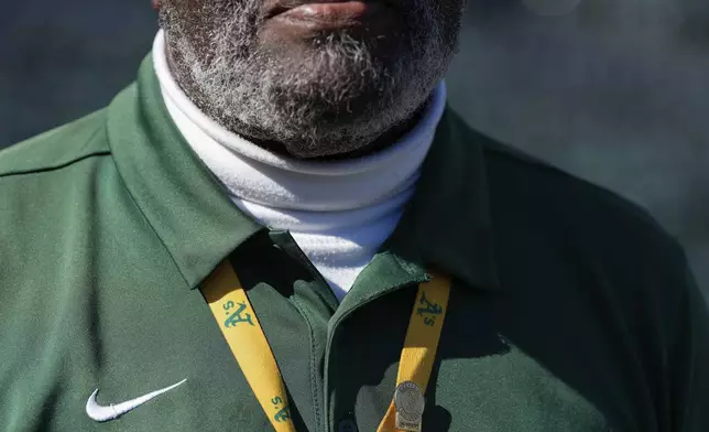 Charles Riley wears a pin for the more than 25 years of working for the Oakland Athletics, Saturday, Sept. 21, 2024, in Oakland, Calif. (AP Photo/Godofredo A. Vásquez)