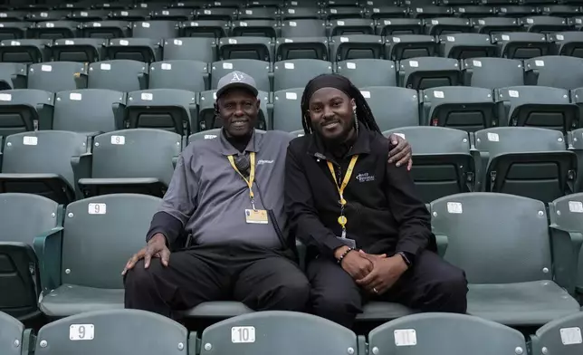 Clyde Williams, left, and his son Derek Williams are photographed at Oakland Coliseum, Friday, May 24, 2024, in Oakland, Calif. (AP Photo/Godofredo A. Vásquez)