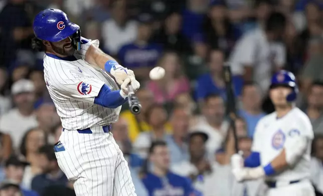 Chicago Cubs' Dansby Swanson hits a three-run home run off Oakland Athletics starting pitcher Joey Estes during the second inning of a baseball game Monday, Sept. 16, 2024, in Chicago. (AP Photo/Charles Rex Arbogast)