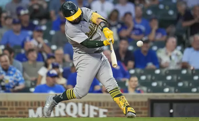 Oakland Athletics' Shea Langeliers hits a two-run home run during the first inning of a baseball game against the Chicago Cubs, Tuesday, Sept. 17, 2024, in Chicago. (AP Photo/Erin Hooley)