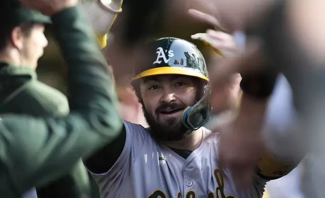 Oakland Athletics' Shea Langeliers celebrates after hitting a two-run home run during the first inning of a baseball game against the Chicago Cubs, Tuesday, Sept. 17, 2024, in Chicago. (AP Photo/Erin Hooley)