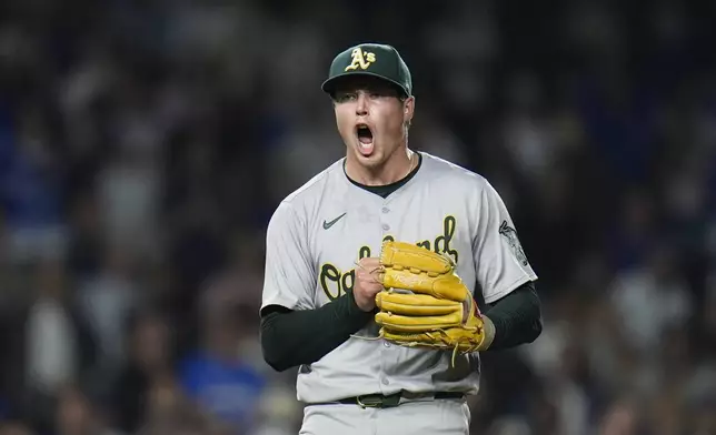 Oakland Athletics pitcher Mason Miller reacts to striking out Chicago Cubs designated hitter Seiya Suzuki to end the baseball game, Tuesday, Sept. 17, 2024, in Chicago. (AP Photo/Erin Hooley)