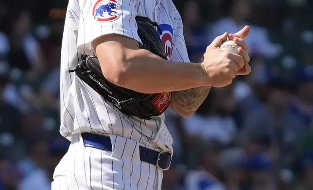 Chicago Cubs relief pitcher Ethan Roberts looks down after Oakland Athletics' Tyler Soderstrom hit a solo home run during the fourth inning of a baseball game in Chicago, Wednesday, Sept. 18, 2024. (AP Photo/Nam Y. Huh)