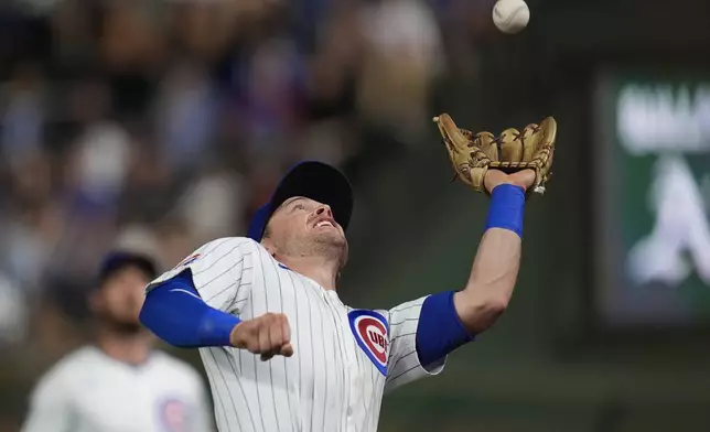 Chicago Cubs second baseman Nico Hoerner catches a pop out from Oakland Athletics' Zack Gelof during the eighth inning of a baseball game, Tuesday, Sept. 17, 2024, in Chicago. (AP Photo/Erin Hooley)