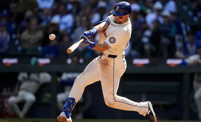 Seattle Mariners' Cal Raleigh hits a two-run home run against the Oakland Athletics during the fifth inning of a baseball game, Sunday, Sept. 29, 2024, in Seattle. (AP Photo/Lindsey Wasson)