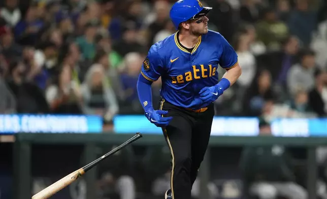 Seattle Mariners' Mitch Garver looks on after hitting a solo home run against the Oakland Athletics during the second inning of a baseball game, Friday, Sept. 27, 2024, in Seattle. (AP Photo/Lindsey Wasson)