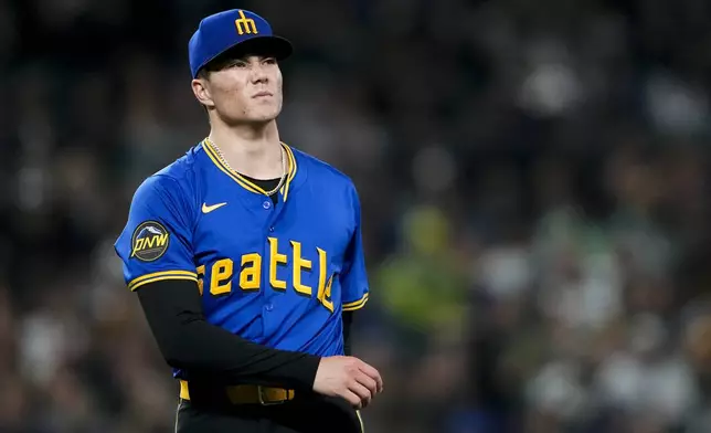 Seattle Mariners starting pitcher Bryan Woo reacts during the third inning of a baseball game against the Oakland Athletics, Friday, Sept. 27, 2024, in Seattle. (AP Photo/Lindsey Wasson)