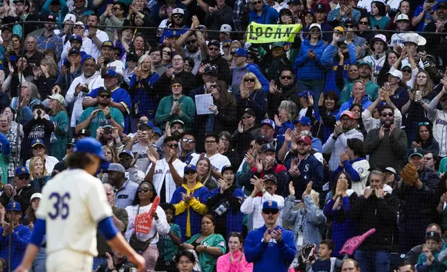 Seattle Mariners starting pitcher Logan Gilbert walks back to the dugout as fans cheer after being pulled from the sixth inning of a baseball game against the Oakland Athletics, Sunday, Sept. 29, 2024, in Seattle. (AP Photo/Lindsey Wasson)