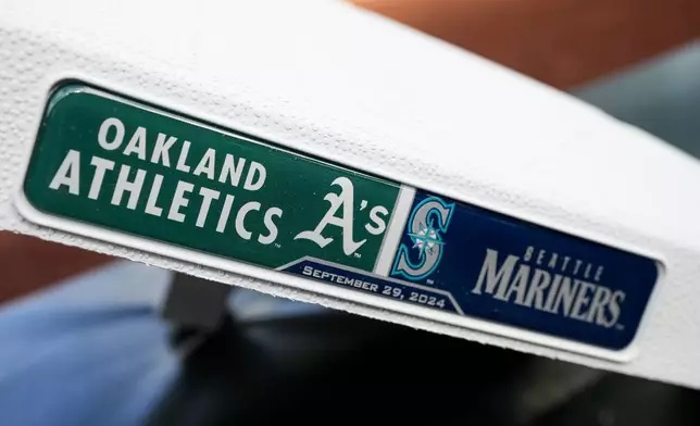 A base showing the Oakland Athletics and the Seattle Mariners logos is seen before a baseball game, Sunday, Sept. 29, 2024, in Seattle. (AP Photo/Lindsey Wasson)