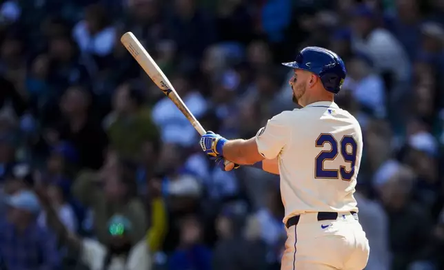 Seattle Mariners' Cal Raleigh follows through on a two-run home run against the Oakland Athletics during the fifth inning of a baseball game, Sunday, Sept. 29, 2024, in Seattle. (AP Photo/Lindsey Wasson)