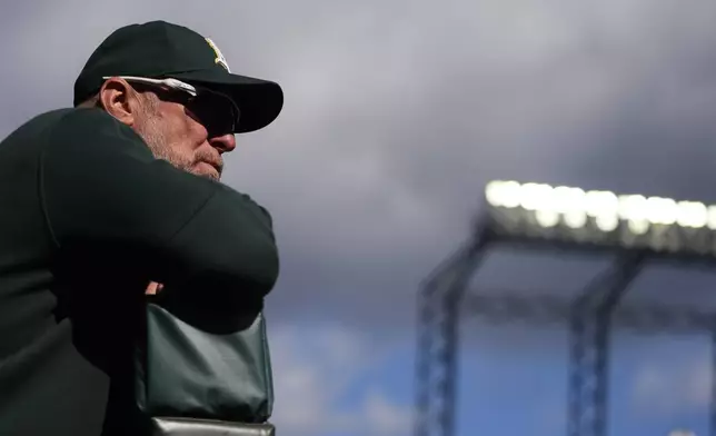 Oakland Athletics manager Mark Kotsay looks out to the field during the first inning of a baseball game against the Seattle Mariners, Sunday, Sept. 29, 2024, in Seattle. (AP Photo/Lindsey Wasson)