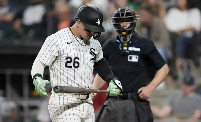 Chicago White Sox's Korey Lee returns to the dugout after striking out in the seventh inning of a baseball game against the Oakland Athletics on Friday, Sept. 13, 2024, in Chicago. (AP Photo/Charles Rex Arbogast)