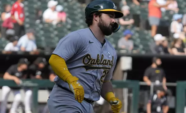 Oakland Athletics' Shea Langeliers rounds the bases after hitting a solo home run during the ninth inning of a baseball game against the Chicago White Sox in Chicago, Sunday, Sept. 15, 2024. (AP Photo/Nam Y. Huh)