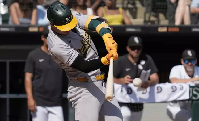 Oakland Athletics' Brent Rooker hits a two-run home run during the fifth inning of a baseball game against the Chicago White Sox in Chicago, Sunday, Sept. 15, 2024. (AP Photo/Nam Y. Huh)