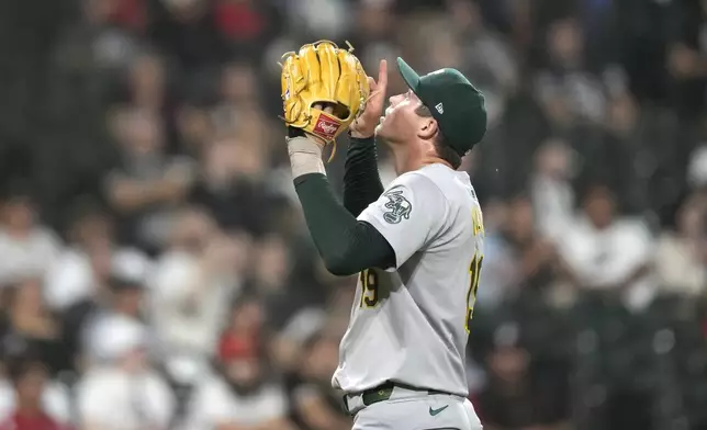 Oakland Athletics relief pitcher Mason Miller celebrates after the team's 2-0 shutout of the Chicago White Sox in a baseball game Friday, Sept. 13, 2024, in Chicago. (AP Photo/Charles Rex Arbogast)