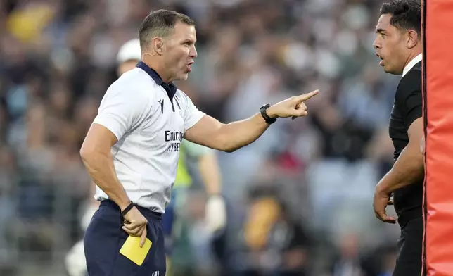 New Zealand's Anton Lienert-Brown, right, is given a yellow card by Karl Dickson during their rugby union test match against Australia in Sydney, Saturday, Sept. 21, 2024. (AP Photo/Rick Rycroft)