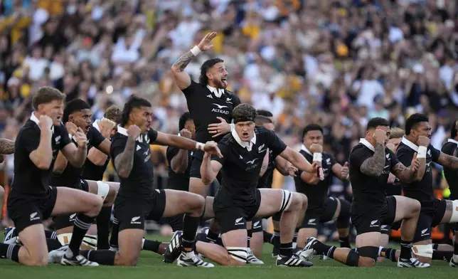 New Zealand's TJ Perenara, center, leads the haka before playing Australia in their rugby union test match in Sydney, Saturday, Sept. 21, 2024. (AP Photo/Rick Rycroft)