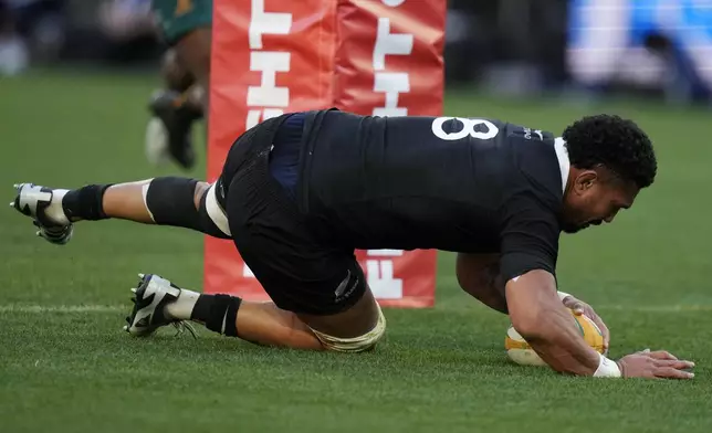 New Zealand's Ardie Savea scores try against Australia during their rugby union test match in Sydney, Saturday, Sept. 21, 2024. (AP Photo/Rick Rycroft)