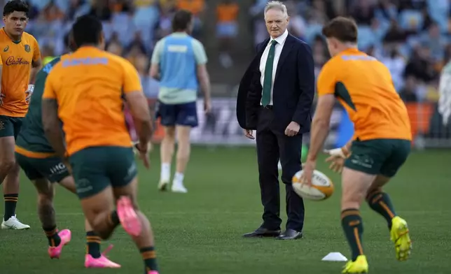 Australia's head coach Joe Schmidt watches his team warm up before playing New Zealand in their rugby union test match in Sydney, Saturday, Sept. 21, 2024. (AP Photo/Rick Rycroft)