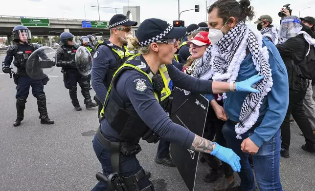 Victoria Police clash with anti-war protesters outside a military arms convention in downtown Melbourne, Australia,Wednesday, Sept. 11, 2024. (Joel Carret/AAP Image via AP)