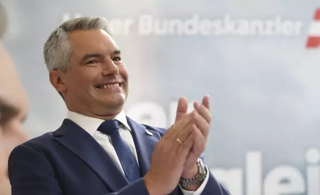 Austrian Chancellor Karl Nehammer of the Peoples Party (OeVP) attends his final election rally in Vienna, Austria, Friday, Sept. 27, 2024. (AP Photo/Heinz-Peter Bader)