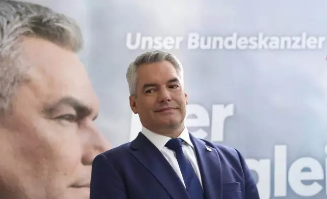 Austrian Chancellor Karl Nehammer of the Peoples Party (OeVP) attends his final election rally in Vienna, Austria, Friday, Sept. 27, 2024. (AP Photo/Heinz-Peter Bader)